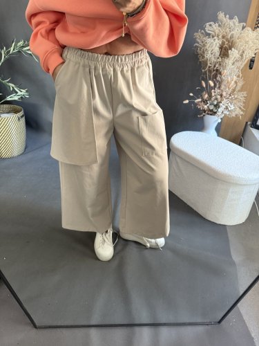 Nohavice s vreckom Sun asymetrický strih-béžové