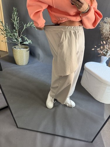 Nohavice s vreckom Sun asymetrický strih-béžové